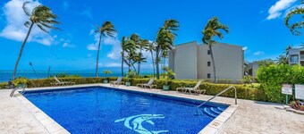 Ocean-view condo with private balcony, washer/dryer, & shared pool/tennis courts