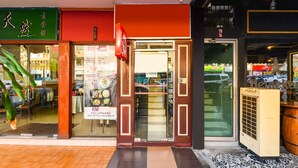 A storefront with a glass door, a signboard, and a Heineken refrigerator. - OYO 90562 J Hotel PJ (Petaling Jaya)