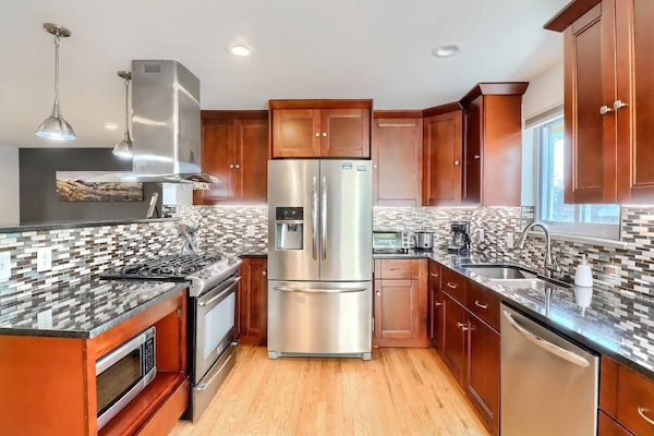 The beautifully updated kitchen provides ample room for your entire group to cook and entertain.