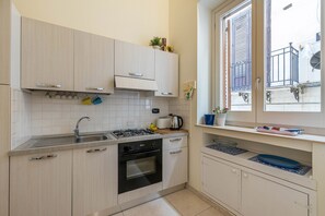 Fridge, coffee/tea maker, electric kettle, toaster