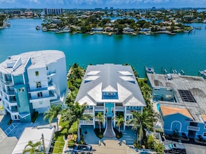 Situated in a coastal area with marina views, this hotel offers a unique roof design and lush surroundings.