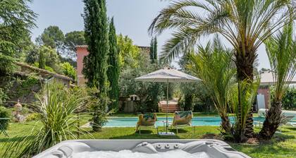 Provencal farmhouse, warm and cozy, nestled in the heart of the pool gardens.
