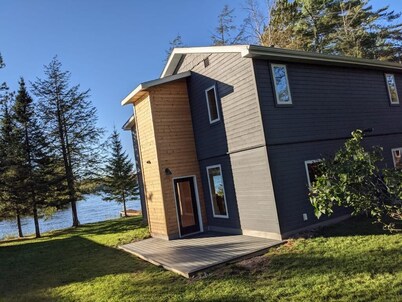 Modern 4-bedroom lake house with private boat dock on the Chain of Lakes!