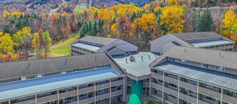 Ski-in/out 2-story condo with balcony, on-site indoor pool, hot tub, sauna, W/D