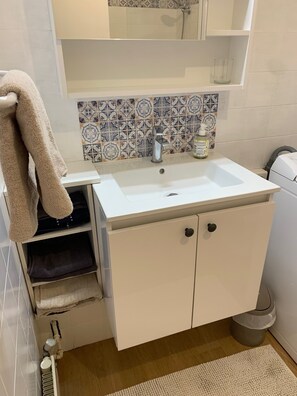 Bathtub, hair dryer, towels, soap