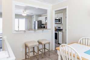 Prepare meals in the kitchen with a microwave and oven, then dine at the adjacent table.