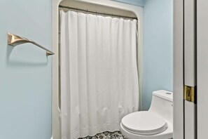 Bathtub, hair dryer, towels