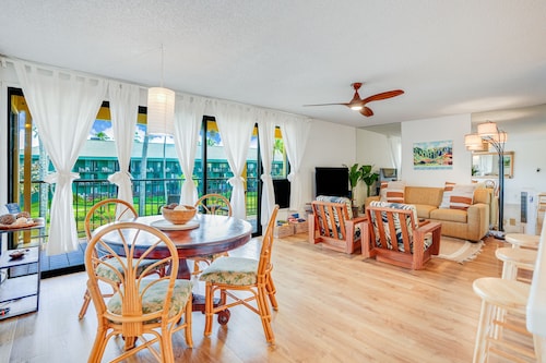 Water-view 3rd-floor condo with community pool & grills - near sights & dining