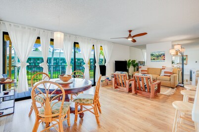 Water-view 3rd-floor condo with community pool & grills - near sights & dining