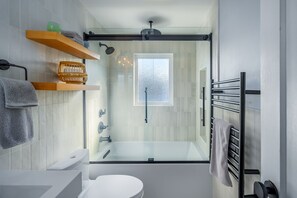 Combined shower/tub, hair dryer, towels, soap