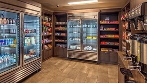 A self-service beverage station with refrigerated drink dispensers and a coffee machine. - Beautiful unit overlooking Mountain ski in ski out luxury property (Breckenridge)