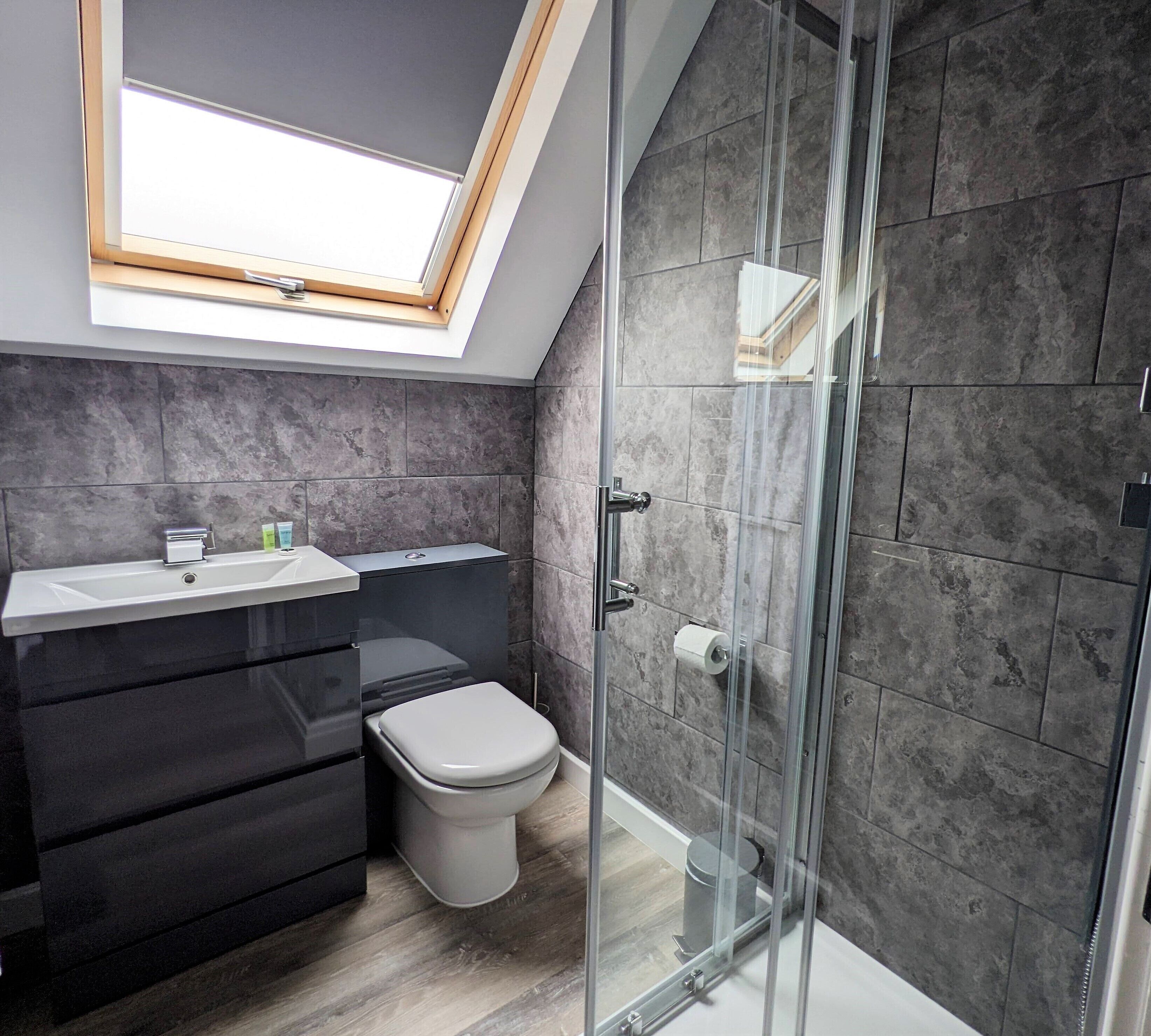 Combined shower/tub, hair dryer, towels, toilet paper