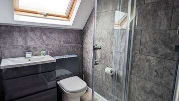 Combined shower/tub, hair dryer, towels, toilet paper