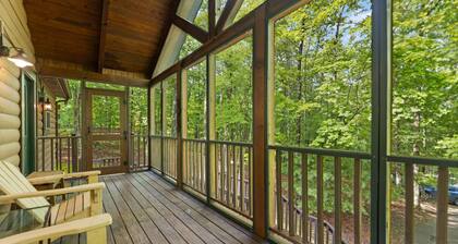 Log Home with fenced in deck & screen porch, cosmopolitan style ranch design.