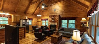 Large Log home, private pond with dock, pool table, hot tub & internet.