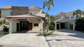 Stylish single-family home with an entrance and covered patio area.