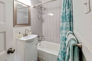 Combined shower/tub, hair dryer, towels, soap