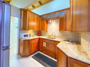 Fridge, microwave, stovetop, coffee/tea maker