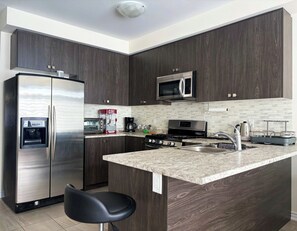 Fridge, microwave, oven, stovetop - Central & Cozy 2BR Townhome—Steps to Plaza, 5 Min Drive to Innisfil Beach Park! (Innisfil)