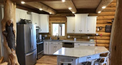 Private Log Cabin with breathtaking views on 15 acres adjacent to forest service