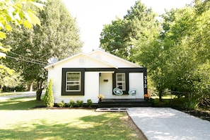 Charming single-story home with a gabled roof and inviting front porch.