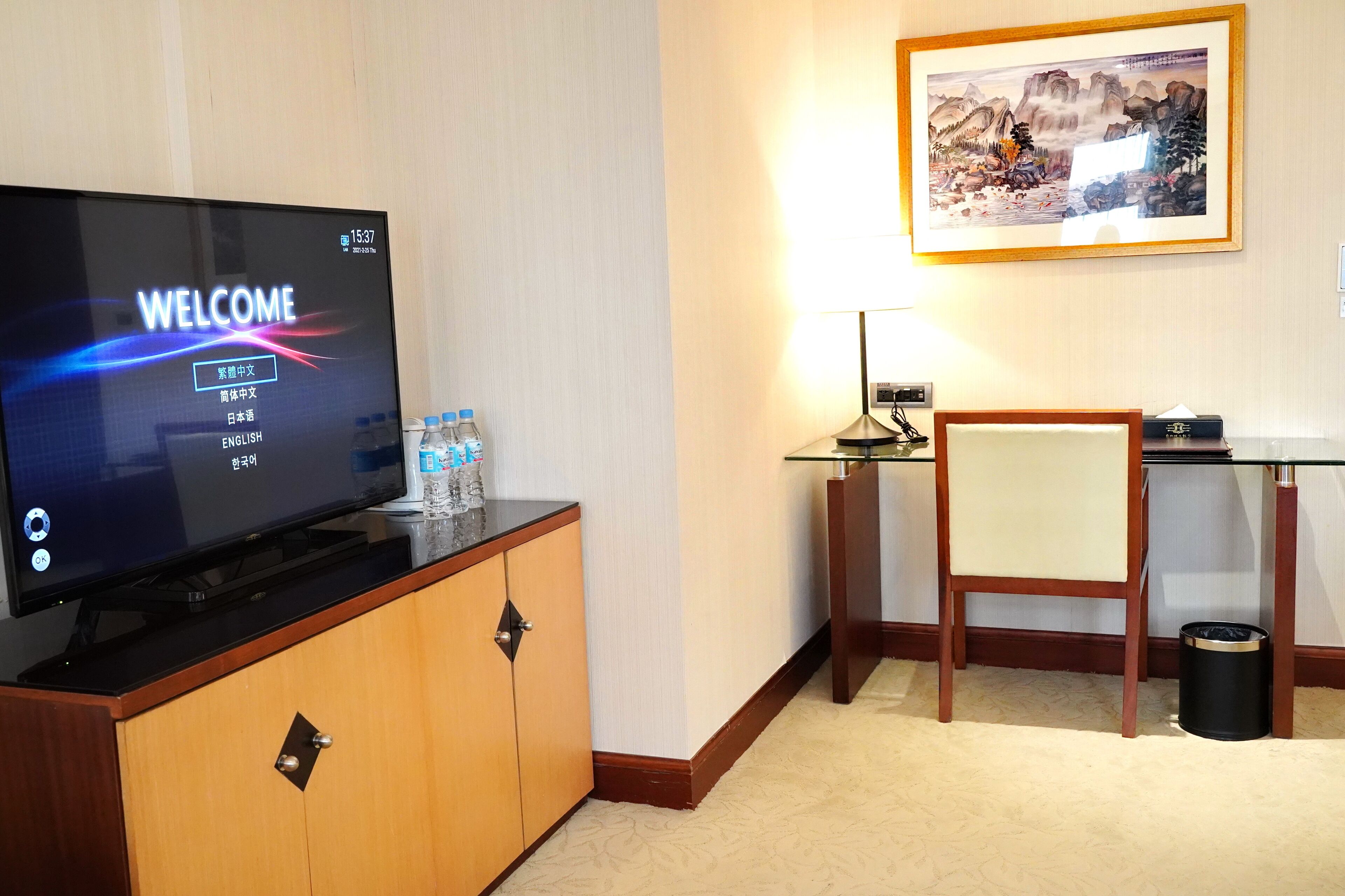 deluxe triple room | living area | 50-inch lcd tv with digital channels, tv