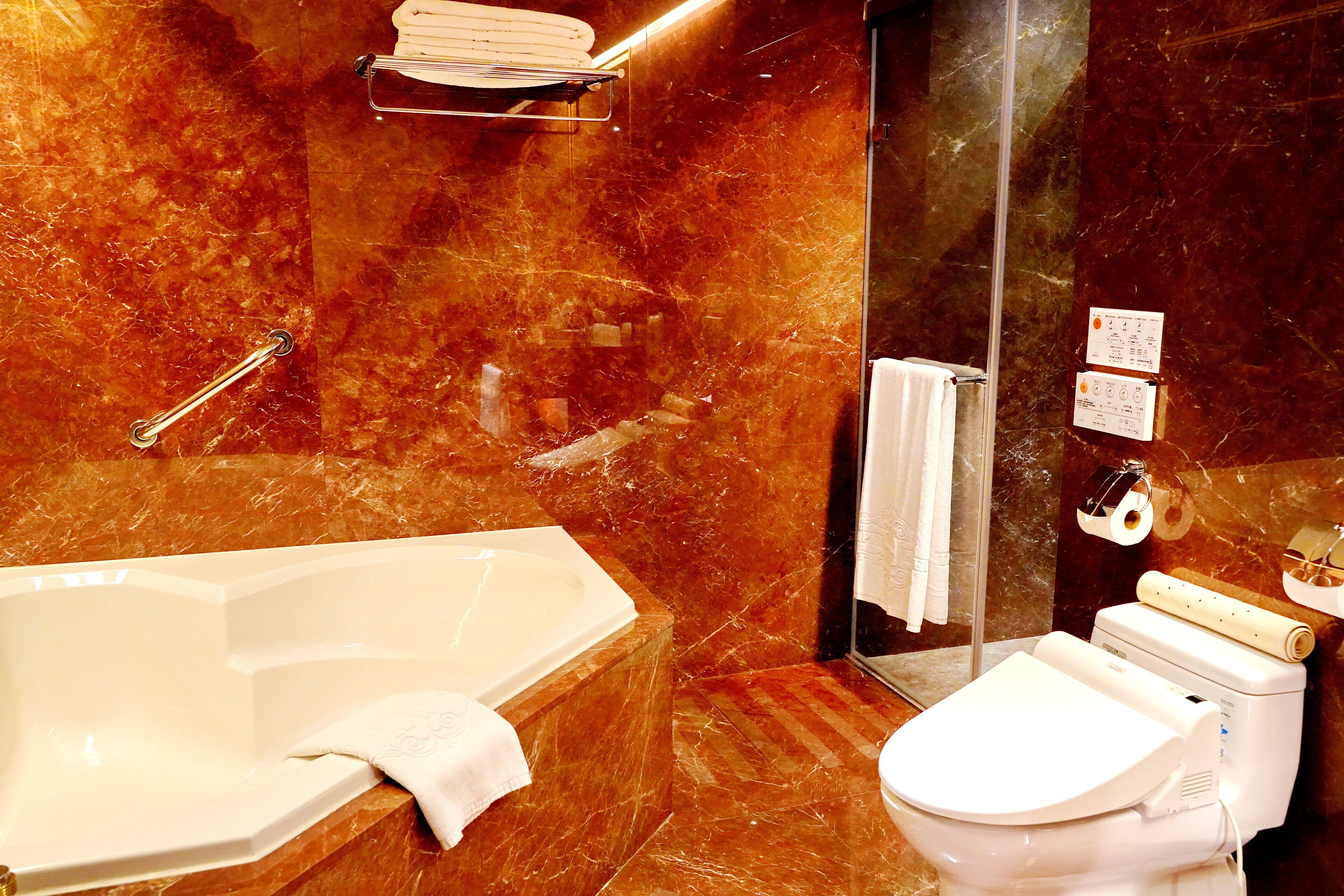 premium room | bathroom | rainfall showerhead, hair dryer, slippers, electronic bidet