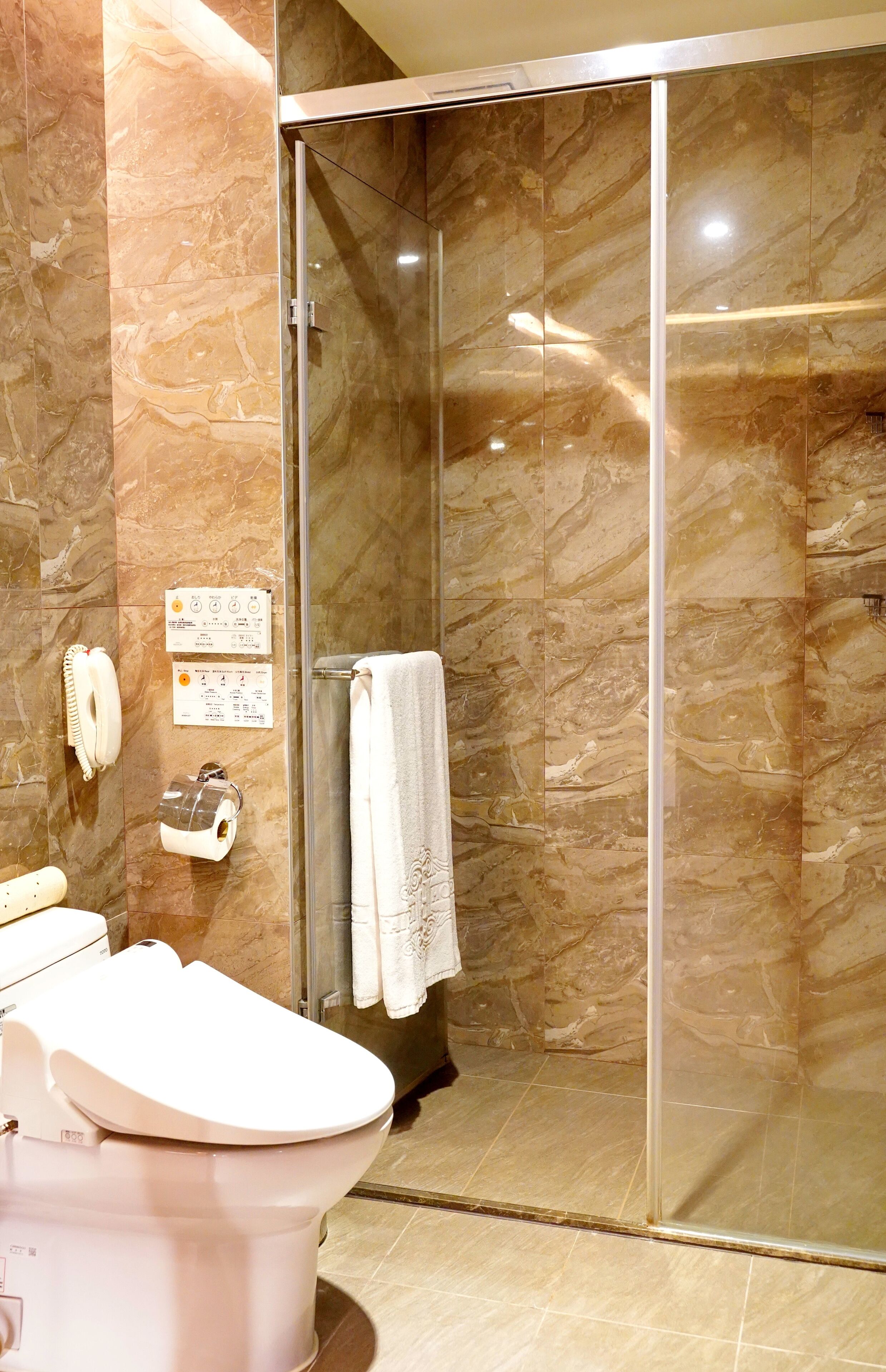 standard room | bathroom | rainfall showerhead, hair dryer, slippers, electronic bidet