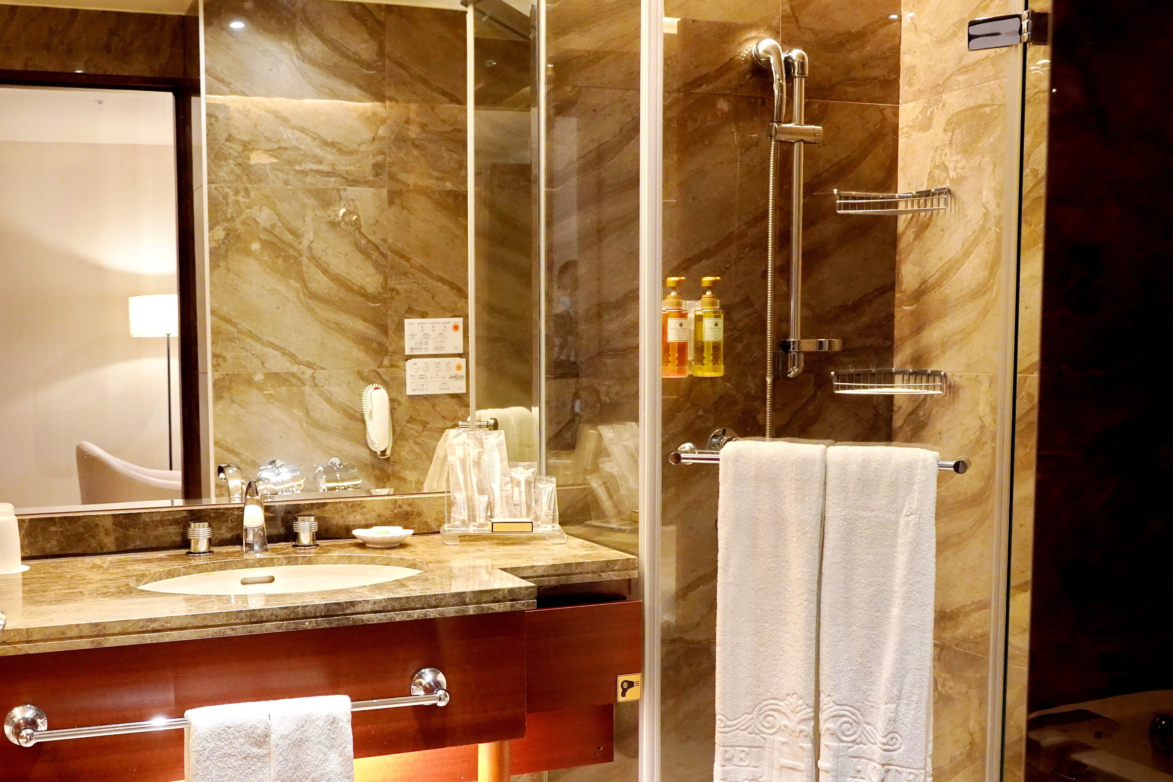executive twin room | bathroom | rainfall showerhead, hair dryer, slippers, electronic bidet