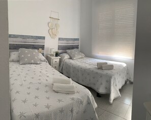 2 dormitorios, tabla de planchar con plancha, wifi gratis y ropa de cama