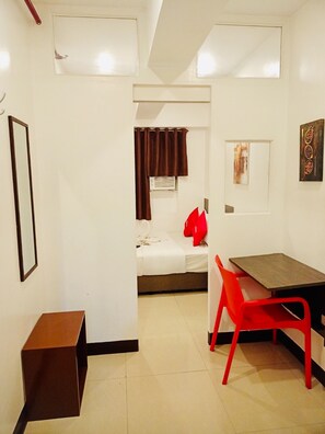 Studio Suite | Living area | 32-inch flat-screen TV with cable channels, TV - OYO 888 City Stay Inns Fortview BGC (Makati)