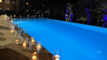 Outdoor pool, open 8:00 AM to midnight, pool umbrellas, pool loungers
