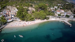 An aerial view of a coastal area with a beach, buildings, and boats. - Large 120 m2 apt With Patio,1 min Walk From Beach (Dugi Rat)
