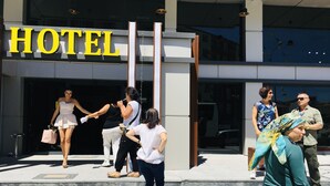 A hotel entrance with a prominent 'HOTEL' sign. - RİSE SUİT OTEL (Sarikaya)