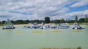 An outdoor water park with various play structures and slides.