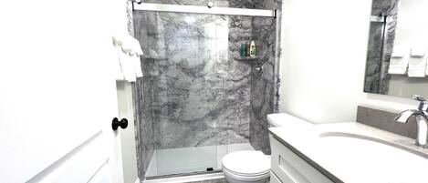 Shower, hair dryer, towels, soap
