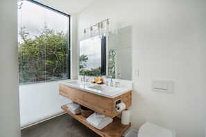 Combined shower/bathtub, hair dryer, towels - Forest Edge Beach House: New Oceanfront Luxury (Cloverdale)