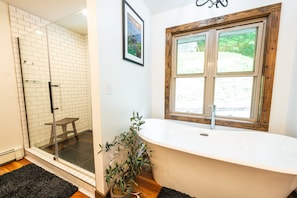 Bathtub, hair dryer, towels, soap