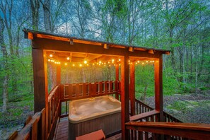 Outdoor spa tub - Cozy cabin getaway with Hot Tub and games; Sleeps 6. Close to lake and trails! (Broken Bow)