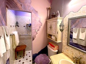 A bathroom with a shower, a toilet, a sink, and a mirror. There is a towel rack and a small stool. - Private Oasis Gorgeous Pool, Lush Gardens in the Senoran Preserve, Cave Creek (Phoenix)