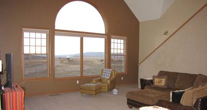 Big beautiful house on Little Sheep Creek at foot of Lima Peaks