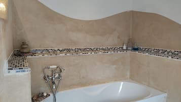 Combined shower/tub, hair dryer, towels, soap