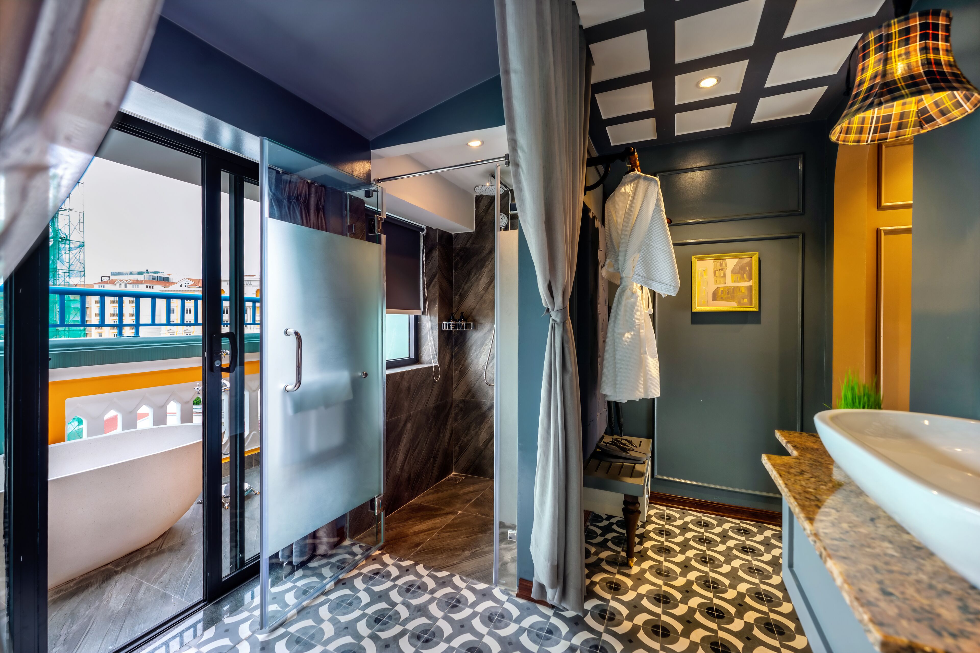 A modern bathroom with a bathtub, shower, and a view of the city.
