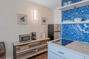 Full-size fridge, microwave, stovetop, coffee/tea maker