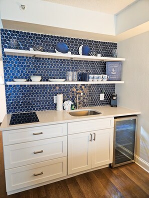 Full-size fridge, microwave, stovetop, coffee/tea maker