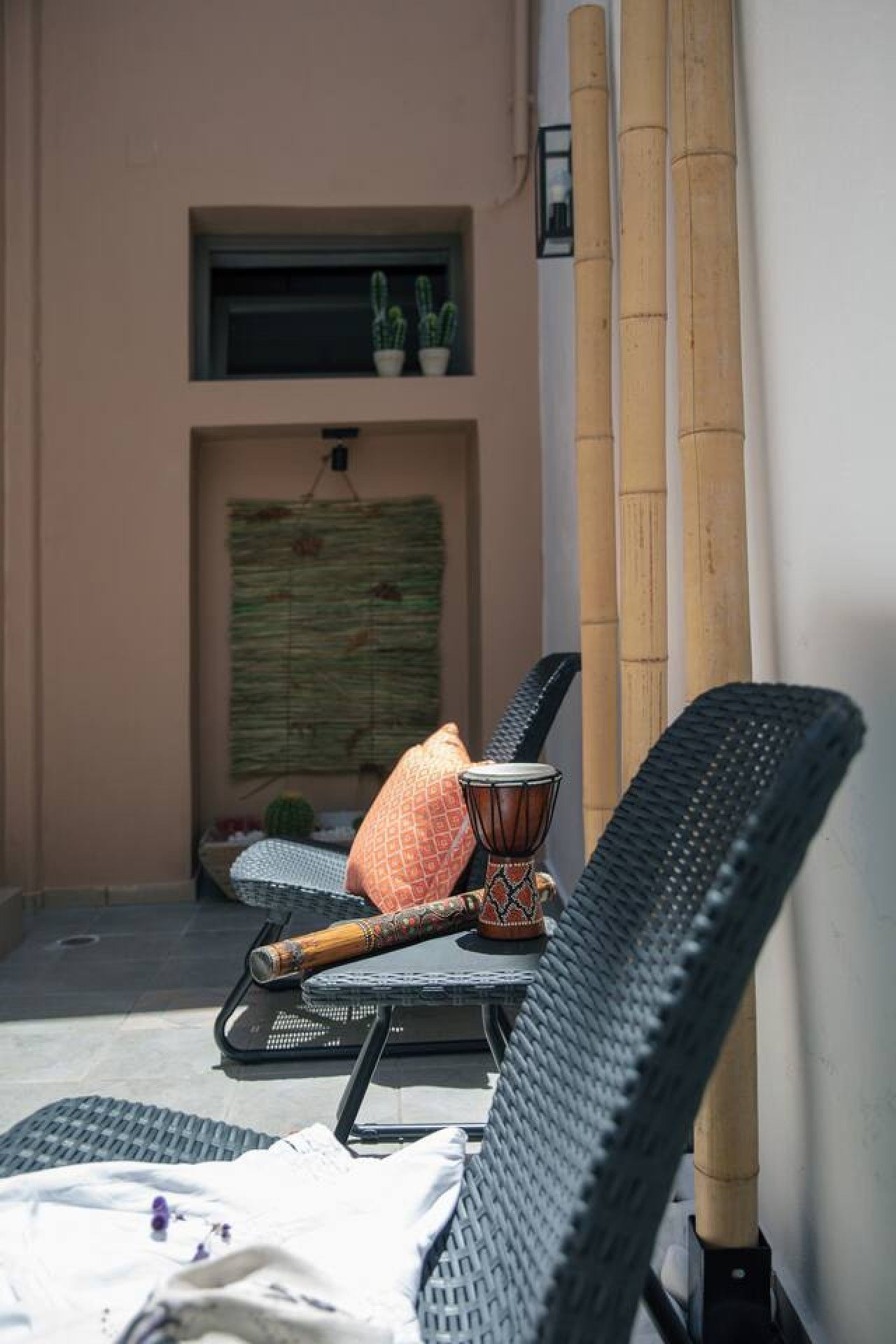 A seating area with a chair, a table, and a decorative item.
