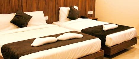 Standard Triple Room | Premium bedding, desk, laptop workspace, blackout drapes