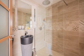 Shower, hair dryer, towels, soap