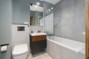 Bathtub, hair dryer, shampoo