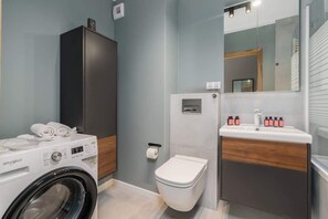 Bathtub, hair dryer, shampoo